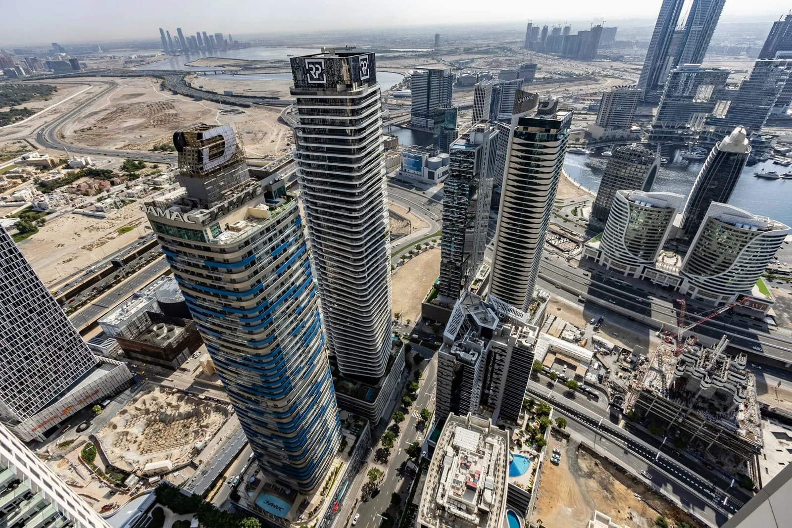 Aerial view of two Business Bay towers on the street grid