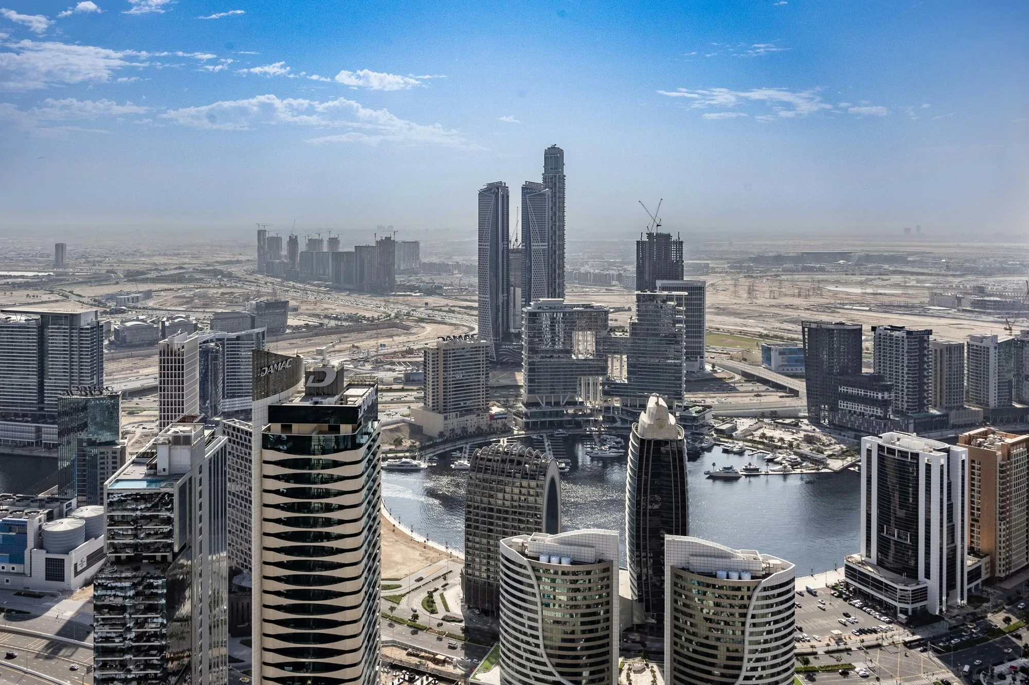 Aerial view of the Business Bay canal basin and towers in Dubai