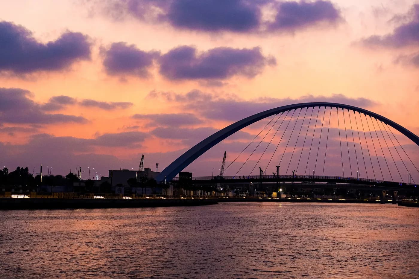 Tolerance Bridge over the Dubai Water Canal at sunset