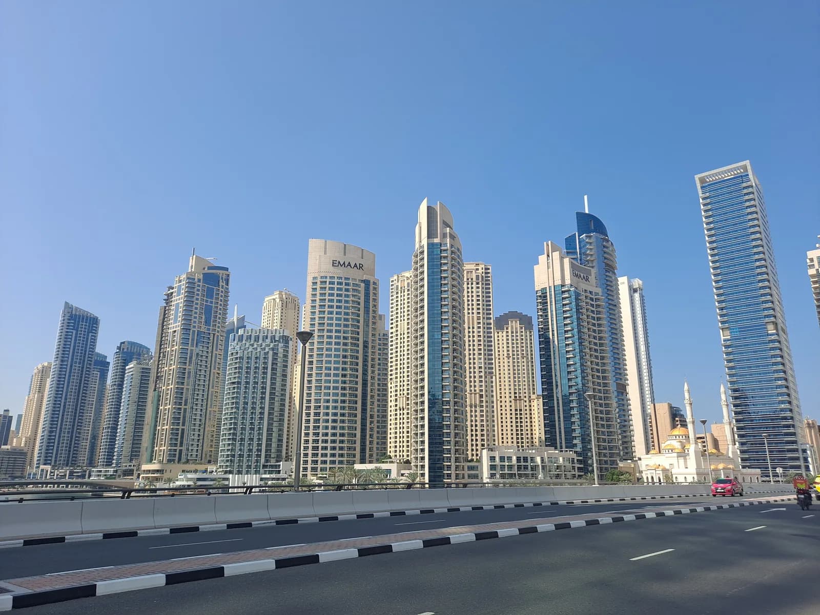 Dubai Marina towers against a blue sky
